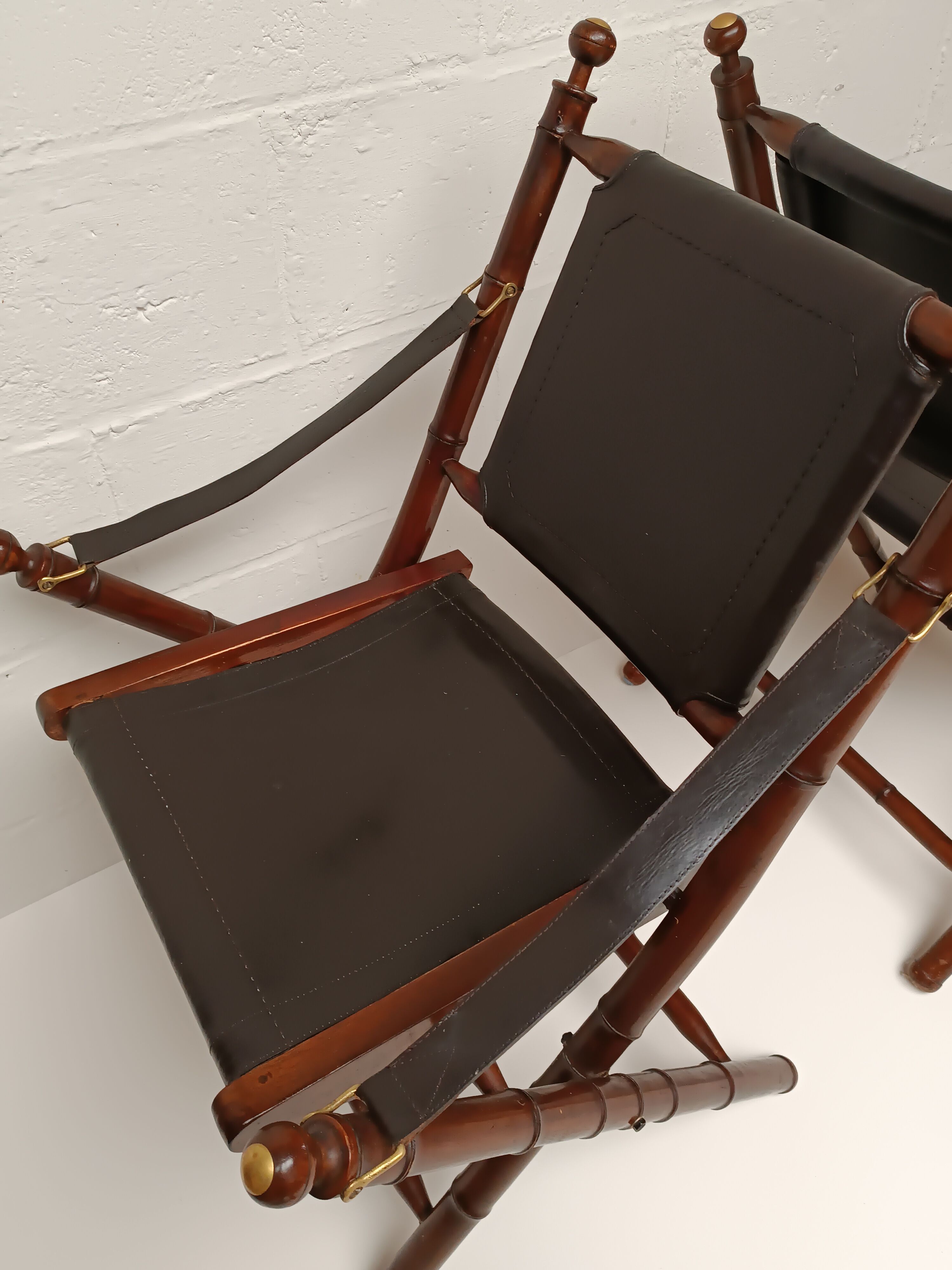 Pair of vintage "safari" folding armchairs in mahogany and leather