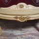Curved display cabinet in Louis XV style, in cream lacquered wood enhanced with gilding.