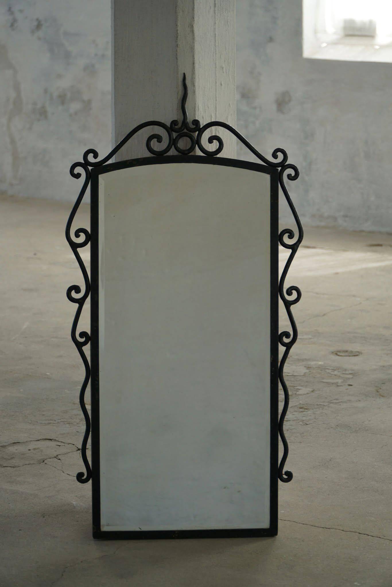 French mid-century brutalist wall mirror in wrought iron, made in the 1950s.