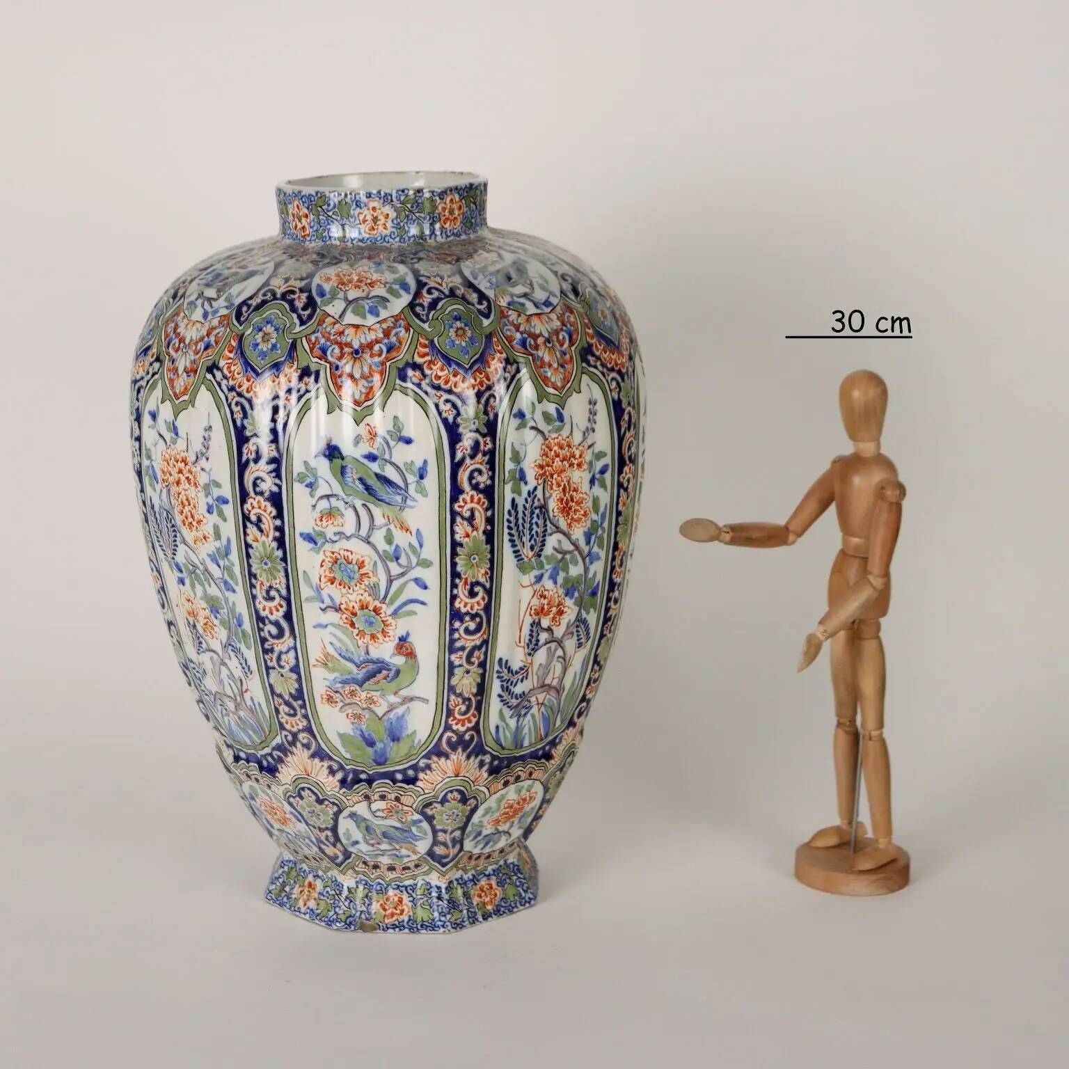 Ancient vase fully decorated with ceramic plants, 20th century.