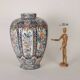 Ancient vase fully decorated with ceramic plants, 20th century.