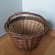 Woven wicker basket with handle