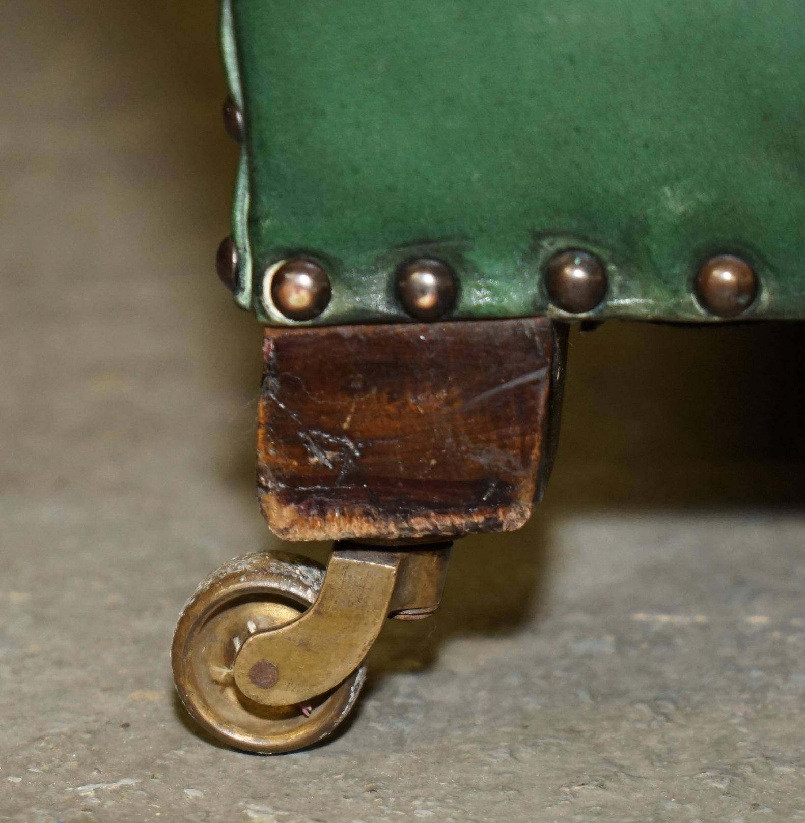 Victorian leather canapé, shield armrests, stamped Maple & Co.