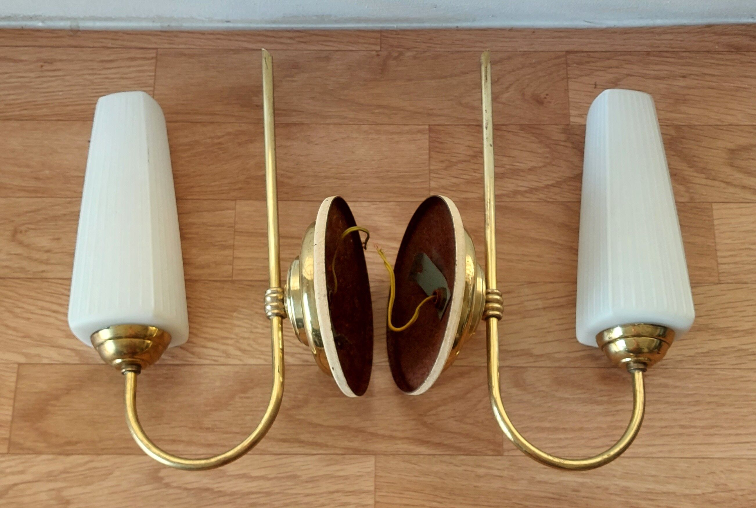 Pair of sconces with a light arm, brass and white opaline 1960.
