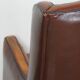 Vintage sheepskin leather armchair finished with black piping