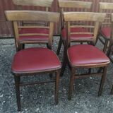 Set of 4 bistro chairs in curved wood and vintage red skai seats.