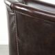 Dark cow leather club armchair with a stylish design in English style