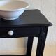 Small Art Deco console reinterpreted – matte black wood with drawer