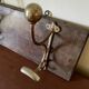 Patinated wood and metal coat rack from the 1950s.