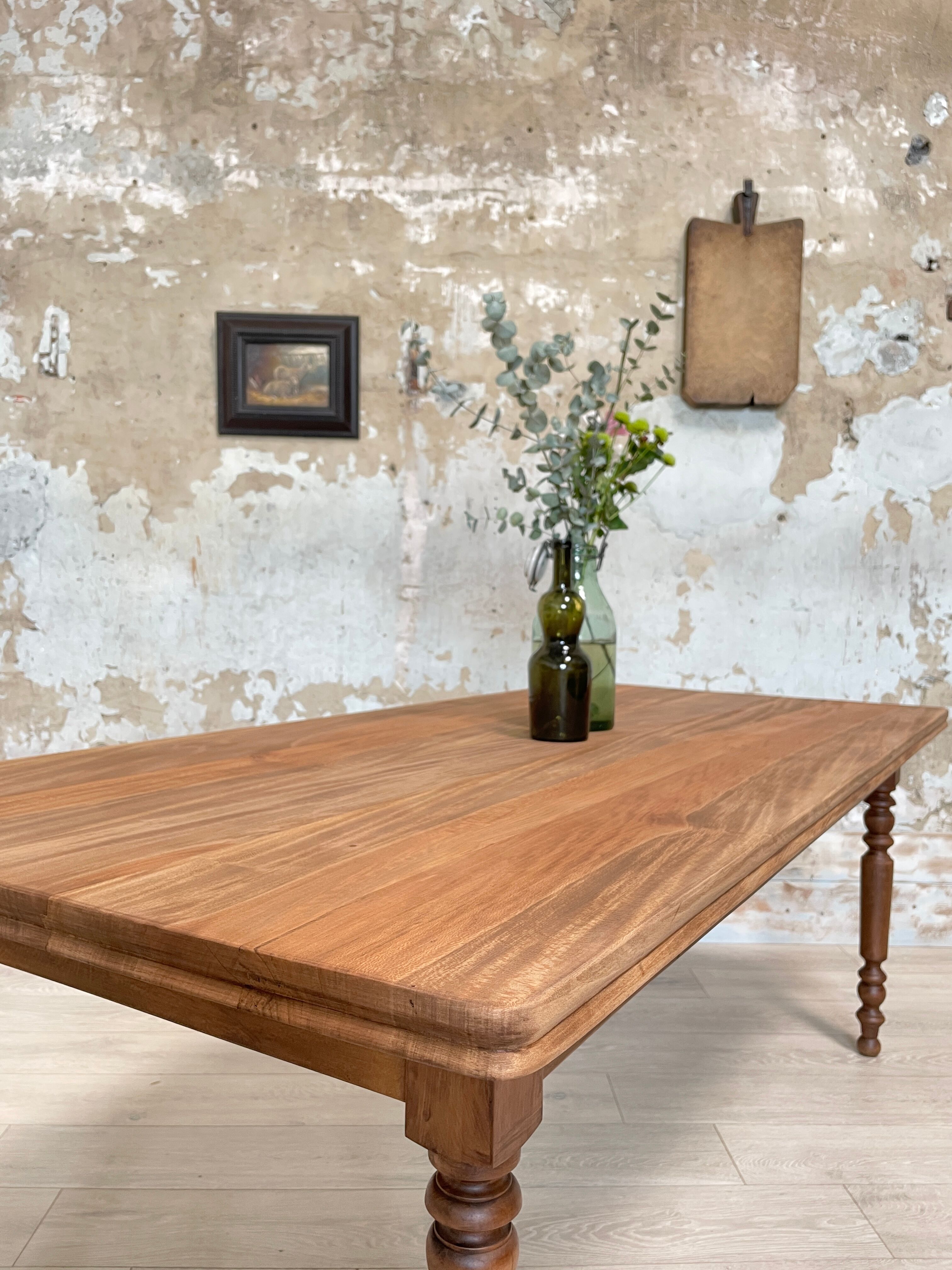 Vintage farmhouse table with turned legs.