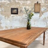 Vintage farmhouse table with turned legs.