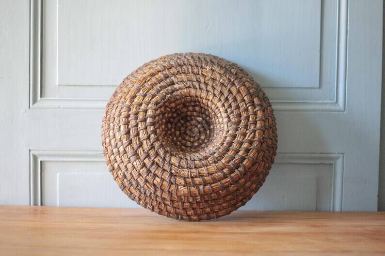 Old wicker basket, straw and bramble, woven basket, countryside, chalet, kitchen, interior decoration.
