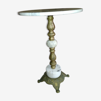 Pedestal table over white and grey marble and grey and brass