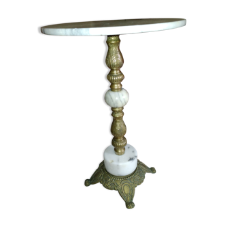 Pedestal table over white and grey marble and grey and brass