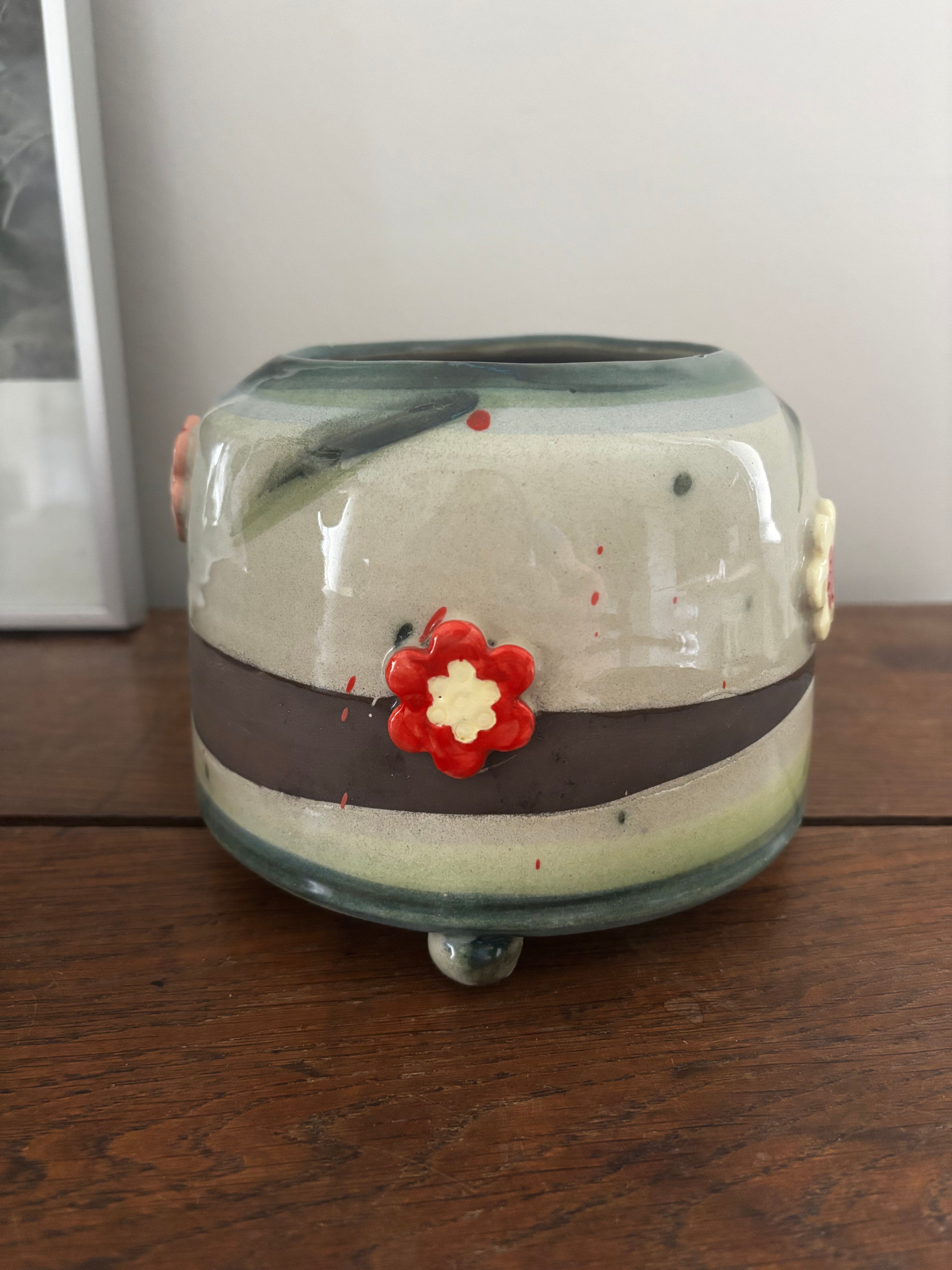 Superb handcrafted pottery pot with relief flowers signed on the back.