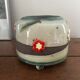 Superb handcrafted pottery pot with relief flowers signed on the back.