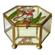 Glass box and hexagonal brass enamelled floral decoration