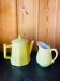 Vintage yellow ceramic teapot and milk jug.