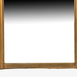 Louis XVI style trumeau in wood and gilded stucco and medallion engraving in the upper part