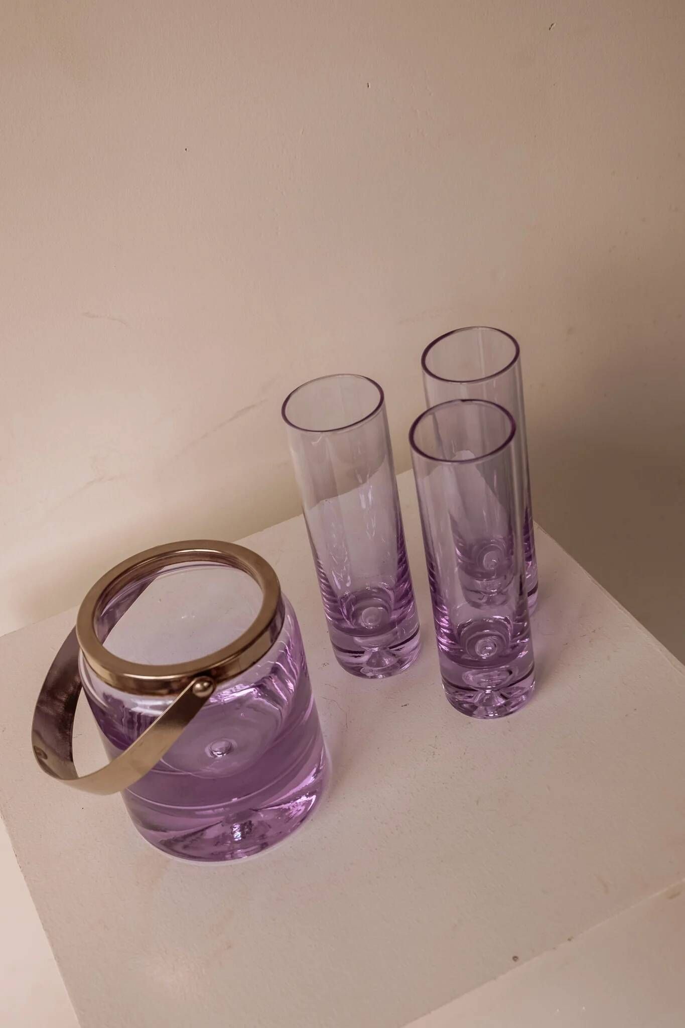 Set of lilac alexandrite liqueur glasses with matching ice bucket.