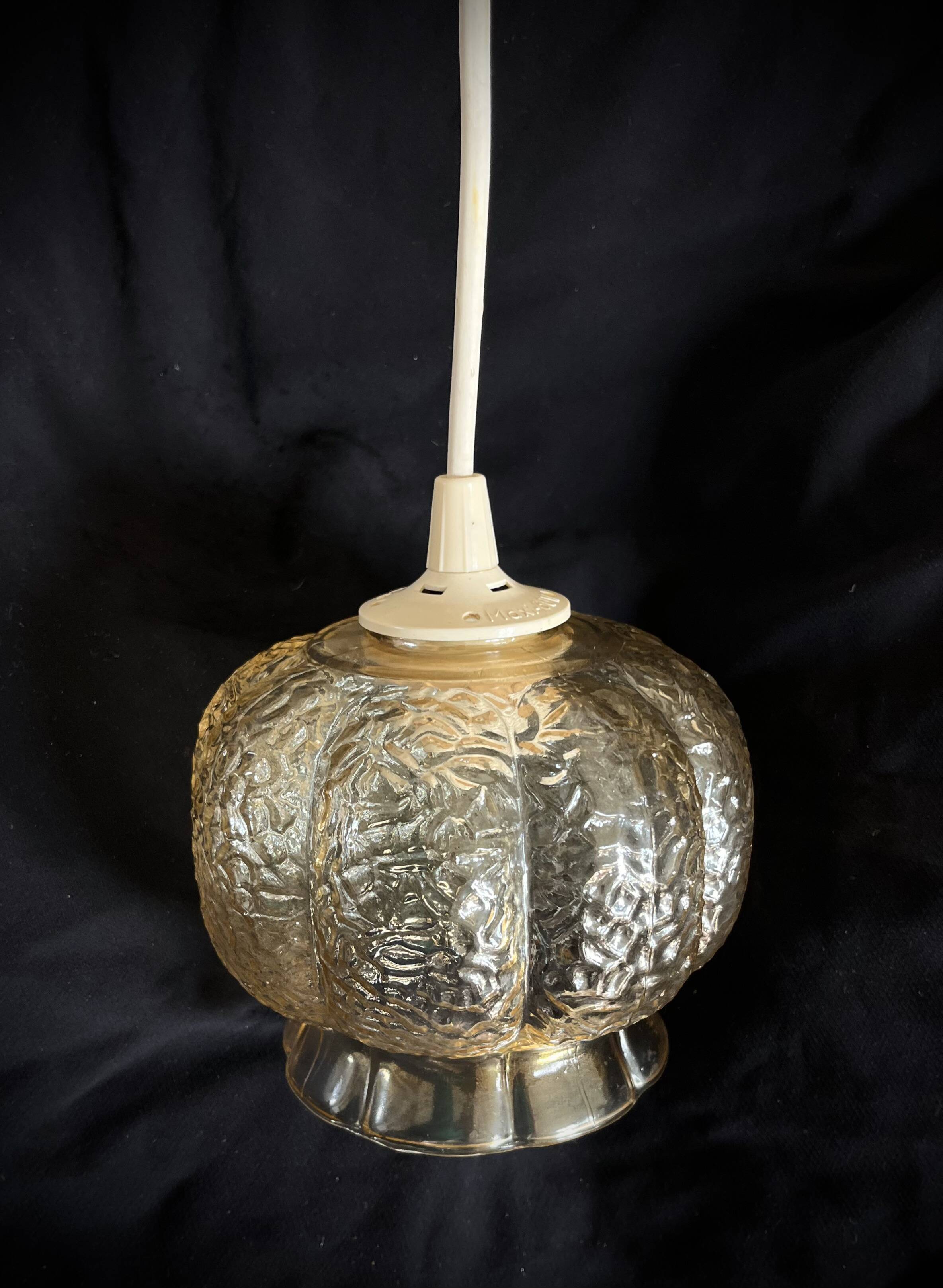 Small glass ball pendant light with amber plant effect