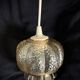 Small glass ball pendant light with amber plant effect