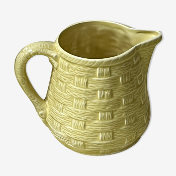 Yellow ceramic pitcher