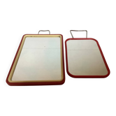 Pair of small red barber-style mirrors.