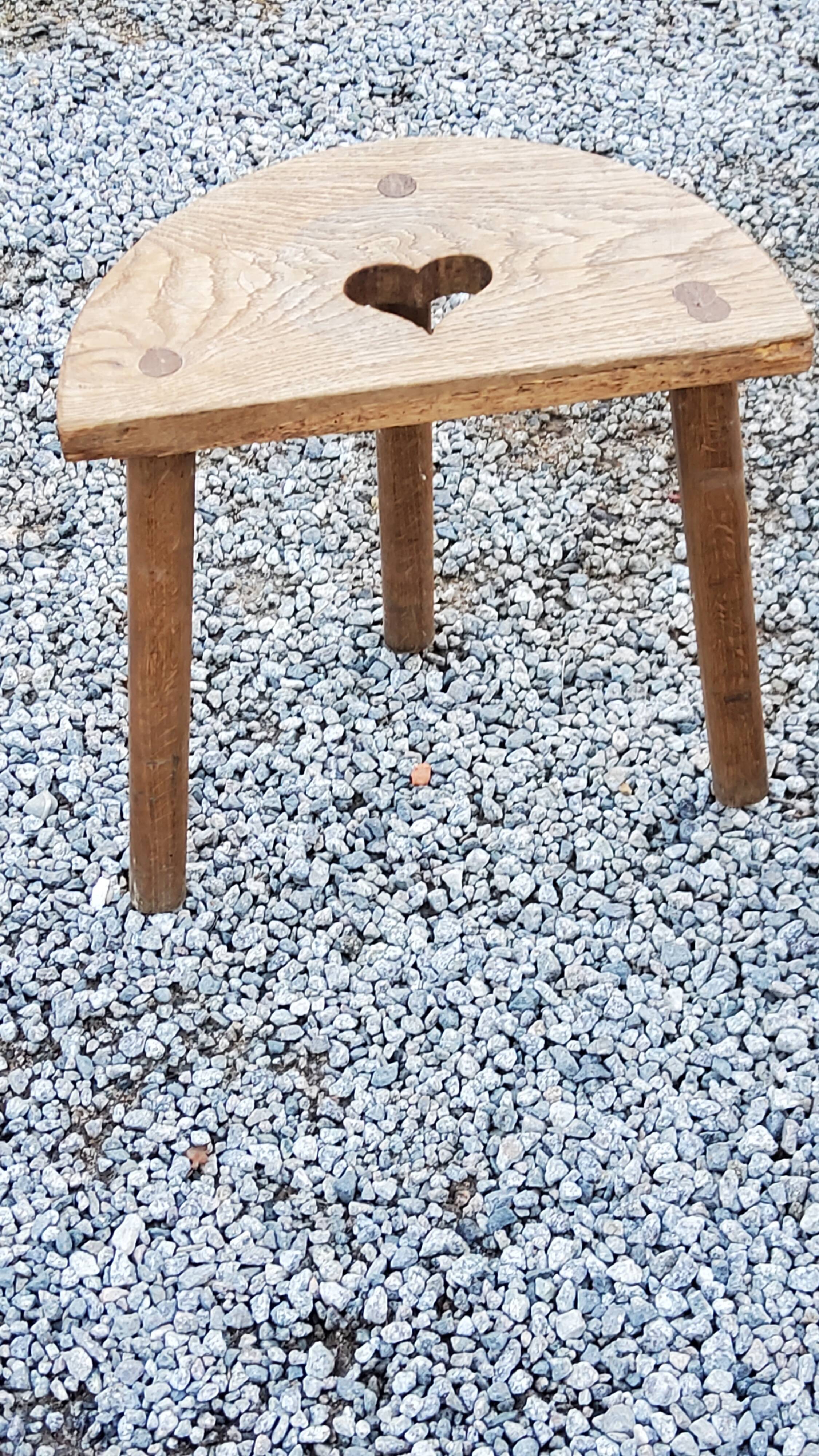 Pair of shepherd's stools in tripod oak décor in the heart