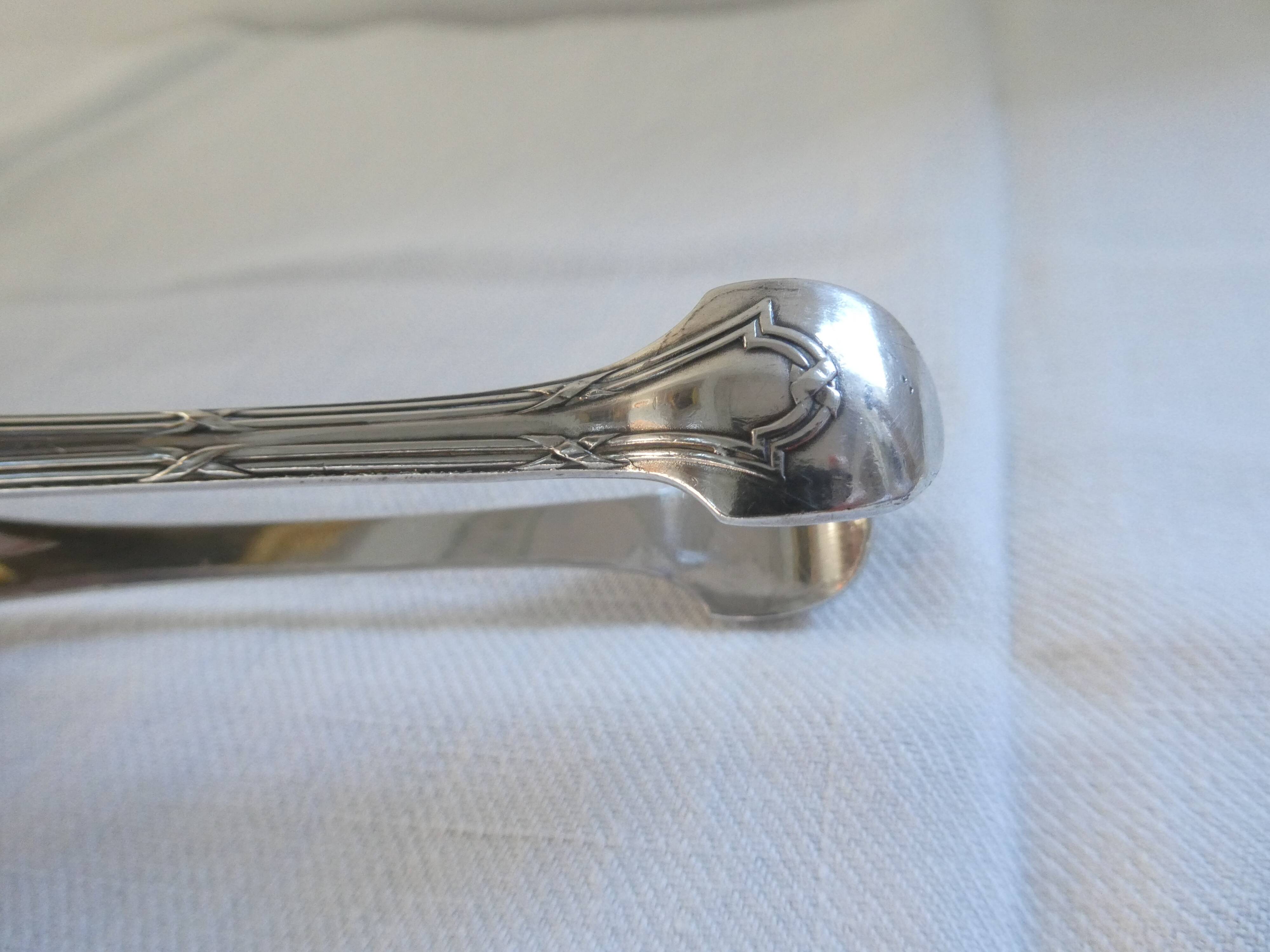 Christofle Silver-plated metal sugar tongs with crossed ribbon bow design