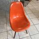 A vintage 70s Eames Herman Miller DSW Fiber Red Orange Dowel Walnut Chair