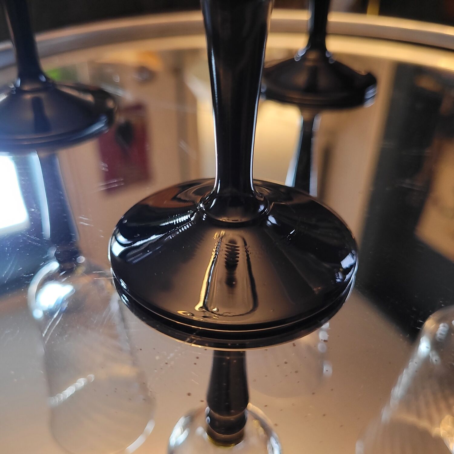 4 clear glass flutes with black stems. 1960–1970. 4 clear glass flutes with black stems.