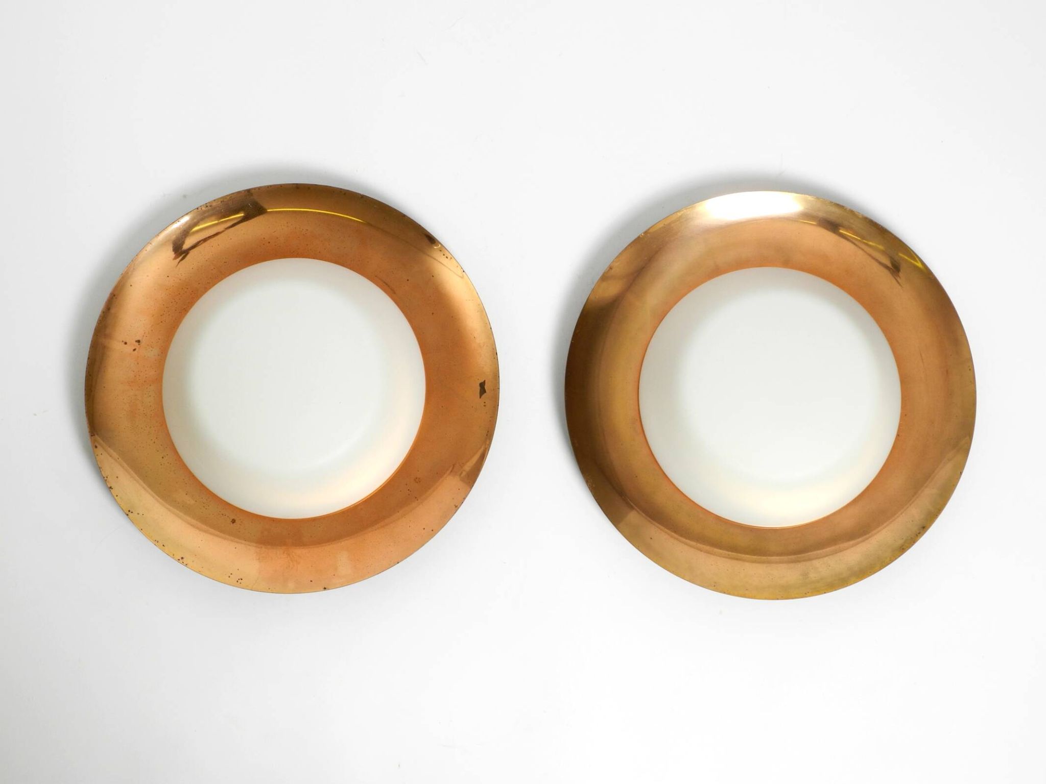 Pair of Mid Century wall or ceiling lamps made of glass with copper-plated