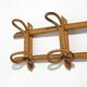 Wall coat rack in rattan and woven wicker, 1960s.