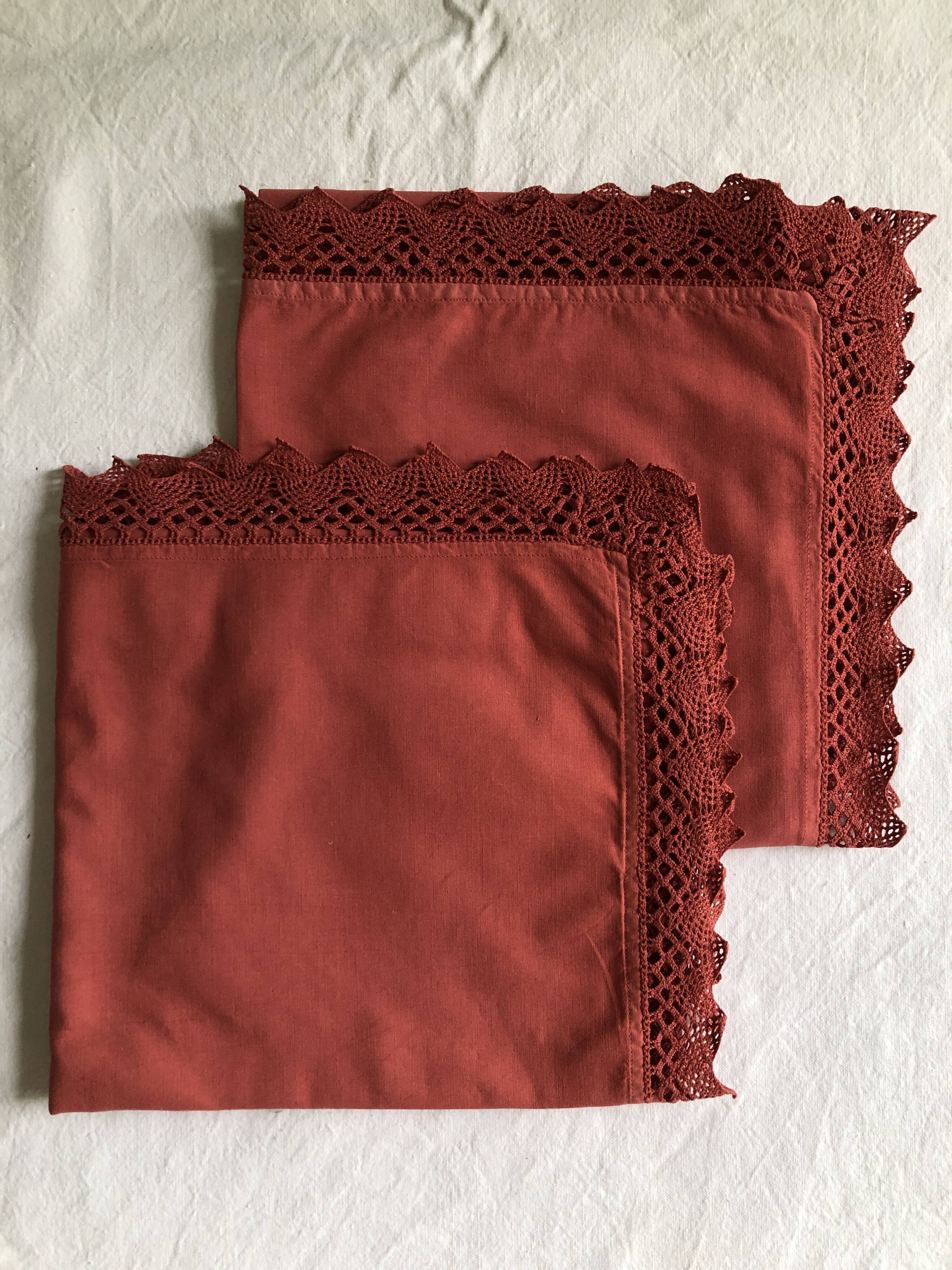 Pair of antique brick red cotton pillowcases