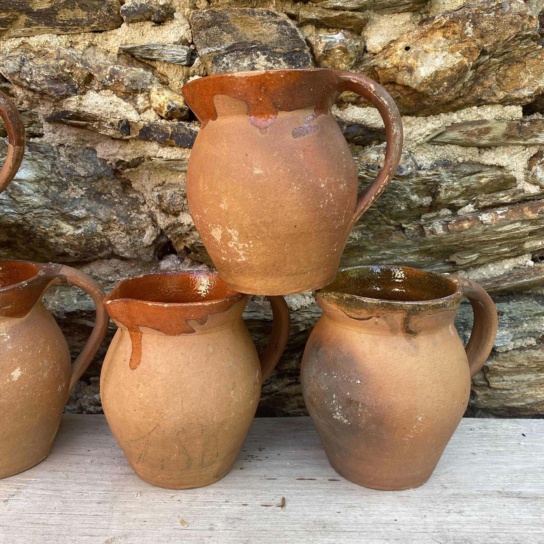 set of terracotta jugs country style