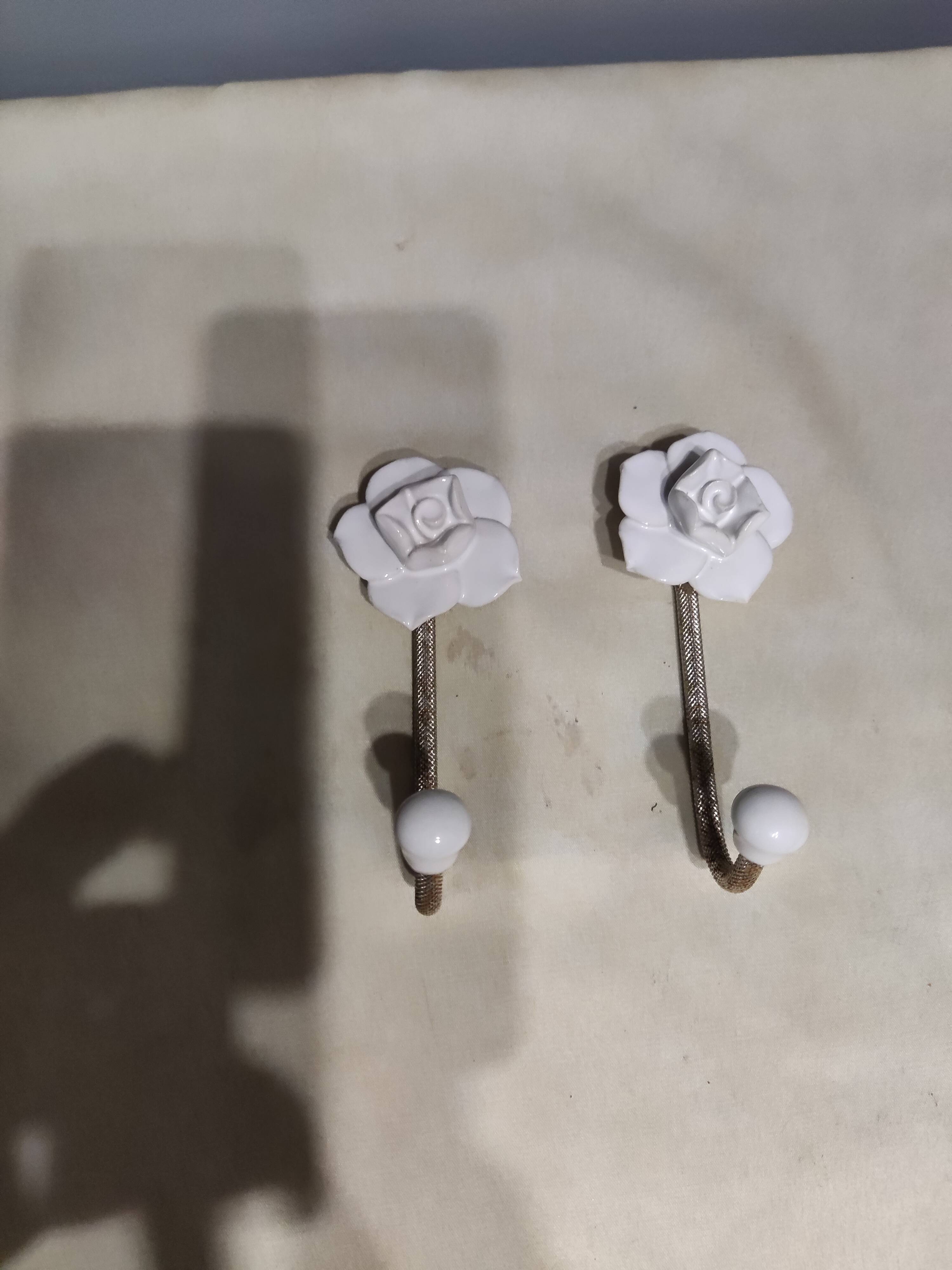 Pair of porcelain hooks
