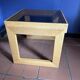 Modernist side table in wood and smoked glass