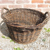 Old round wicker linen basket, dark rattan