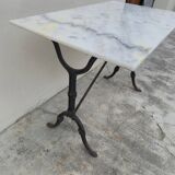Antique cast iron and marble bistro restaurant table