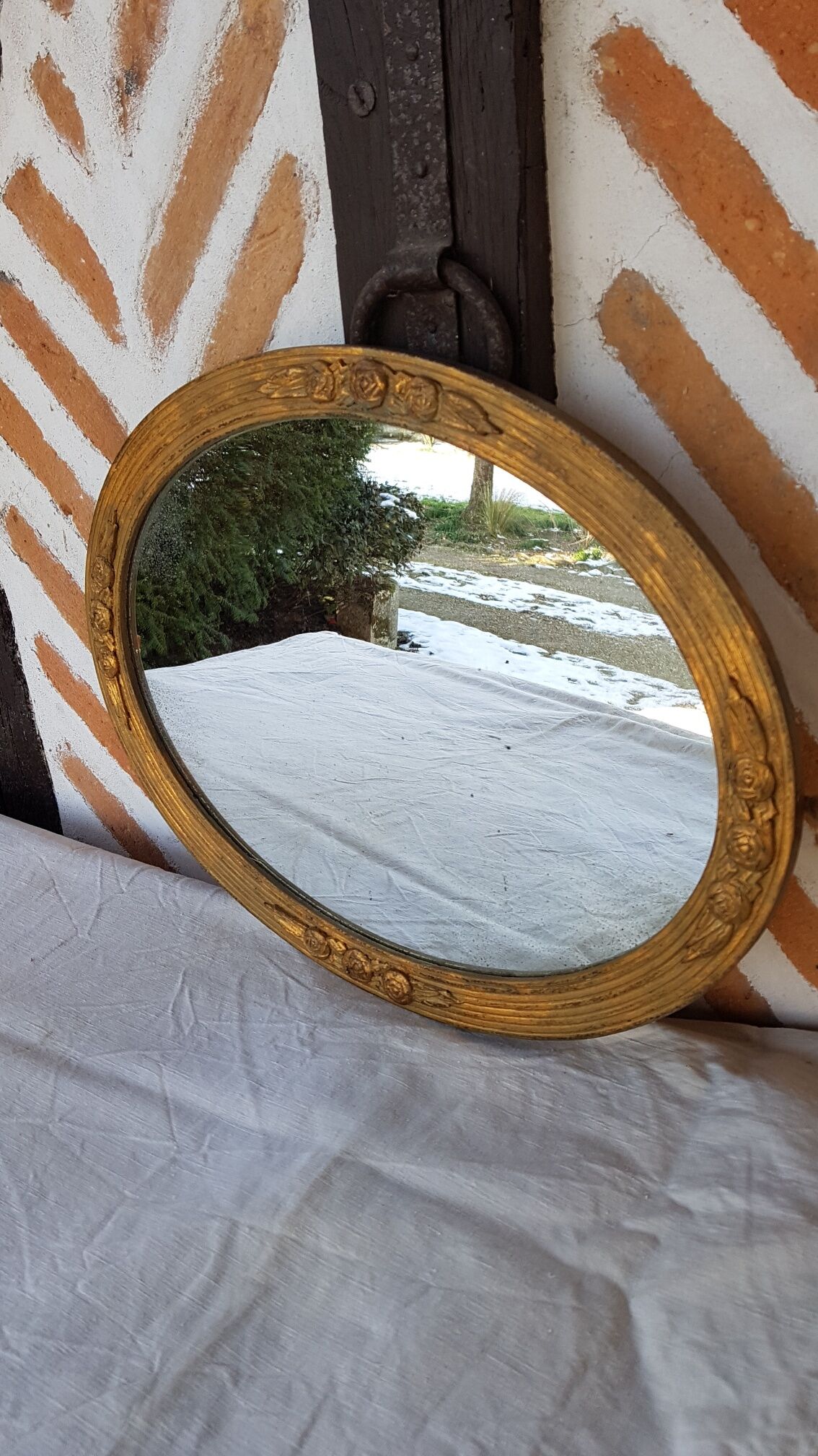 Art Deco golden oval mirror