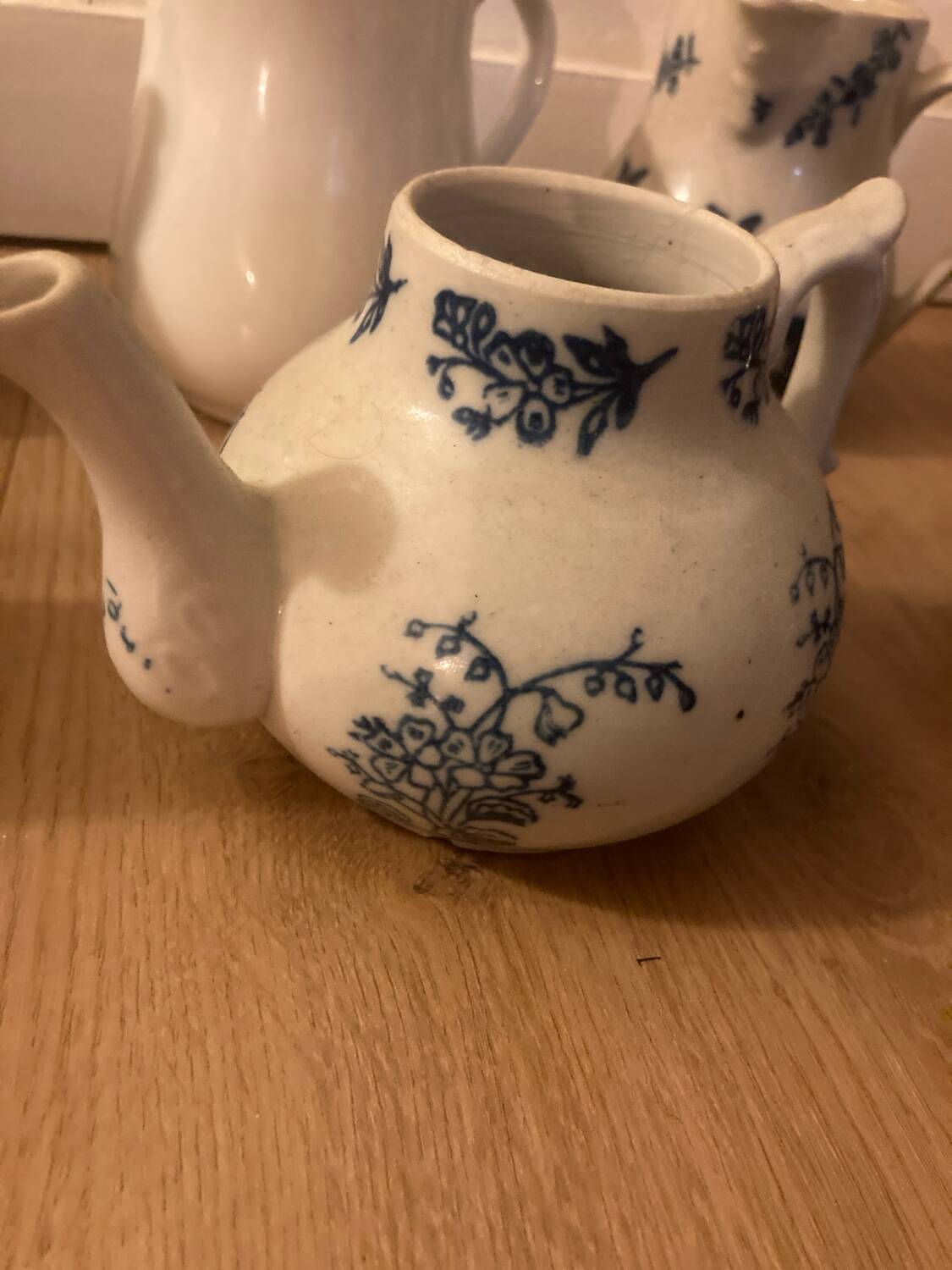 During antique milk jugs at a flea market.