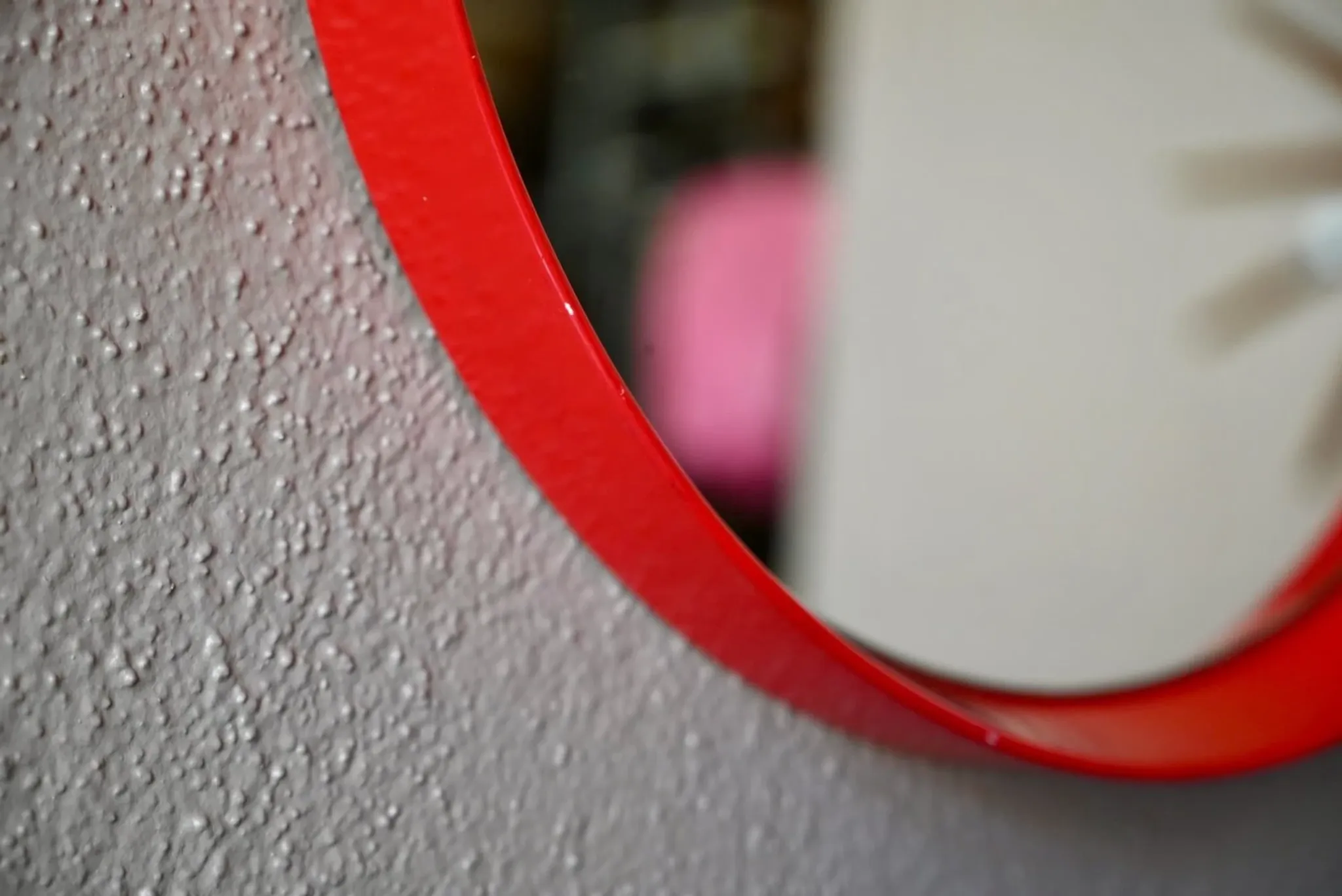 Round Pop Art mirror from the 60s-70s in bright red plastic.