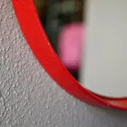 Round Pop Art mirror from the 60s-70s in bright red plastic.