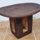 African monoxyle side table in carved wood with a curved top, 48x36 cm.