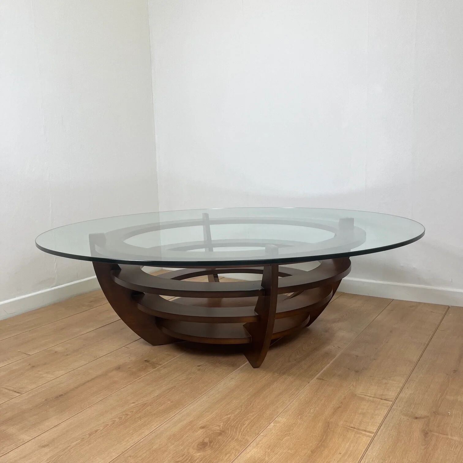 Sculptural coffee table with concentric rings, glass and wood, circa 1985.
