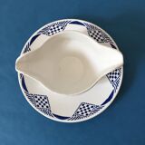 Porcelain gravy boat stamped Moulin des Loups & Hamage - Orchies. “Puppet” model