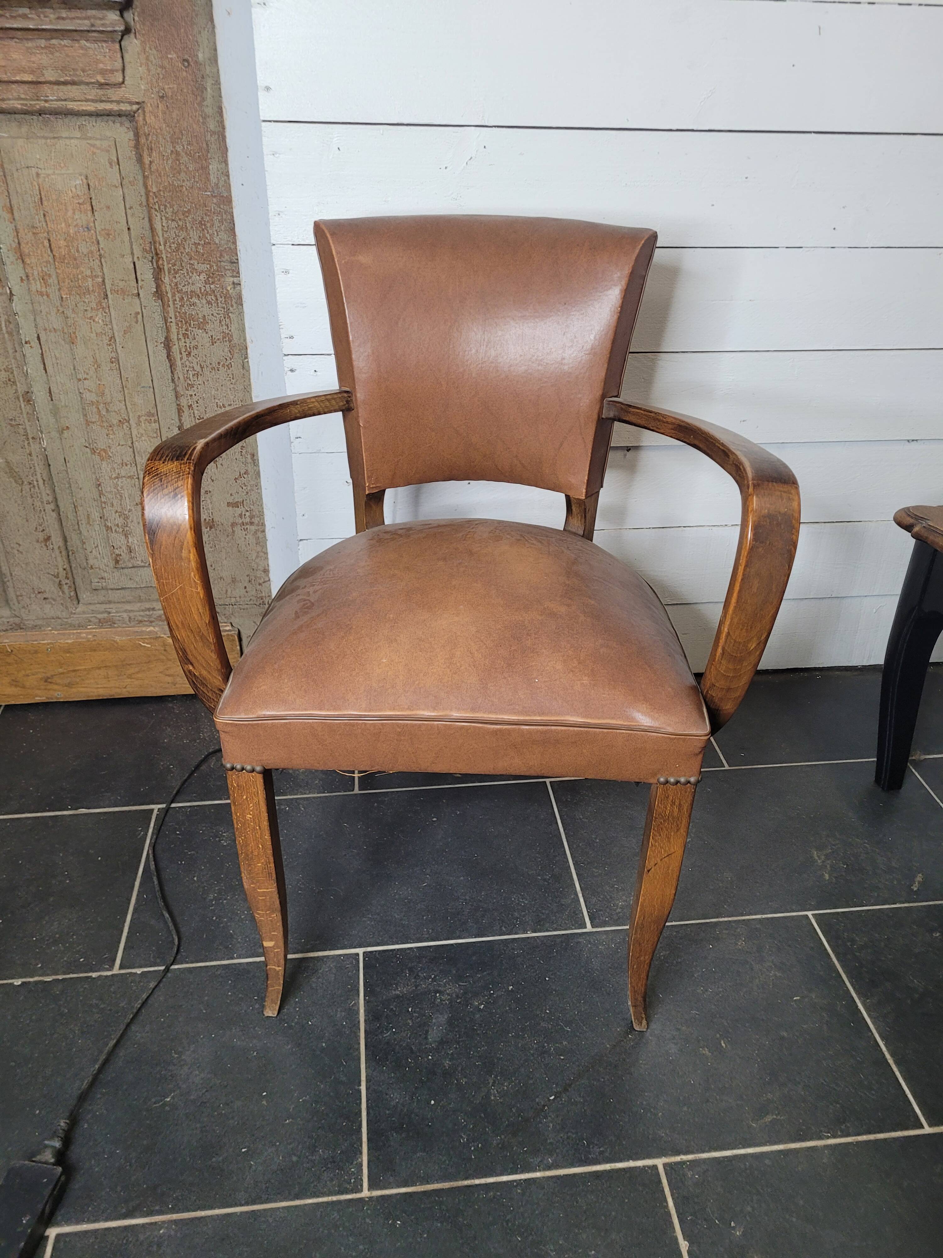Bridge armchair in skai from the 60s