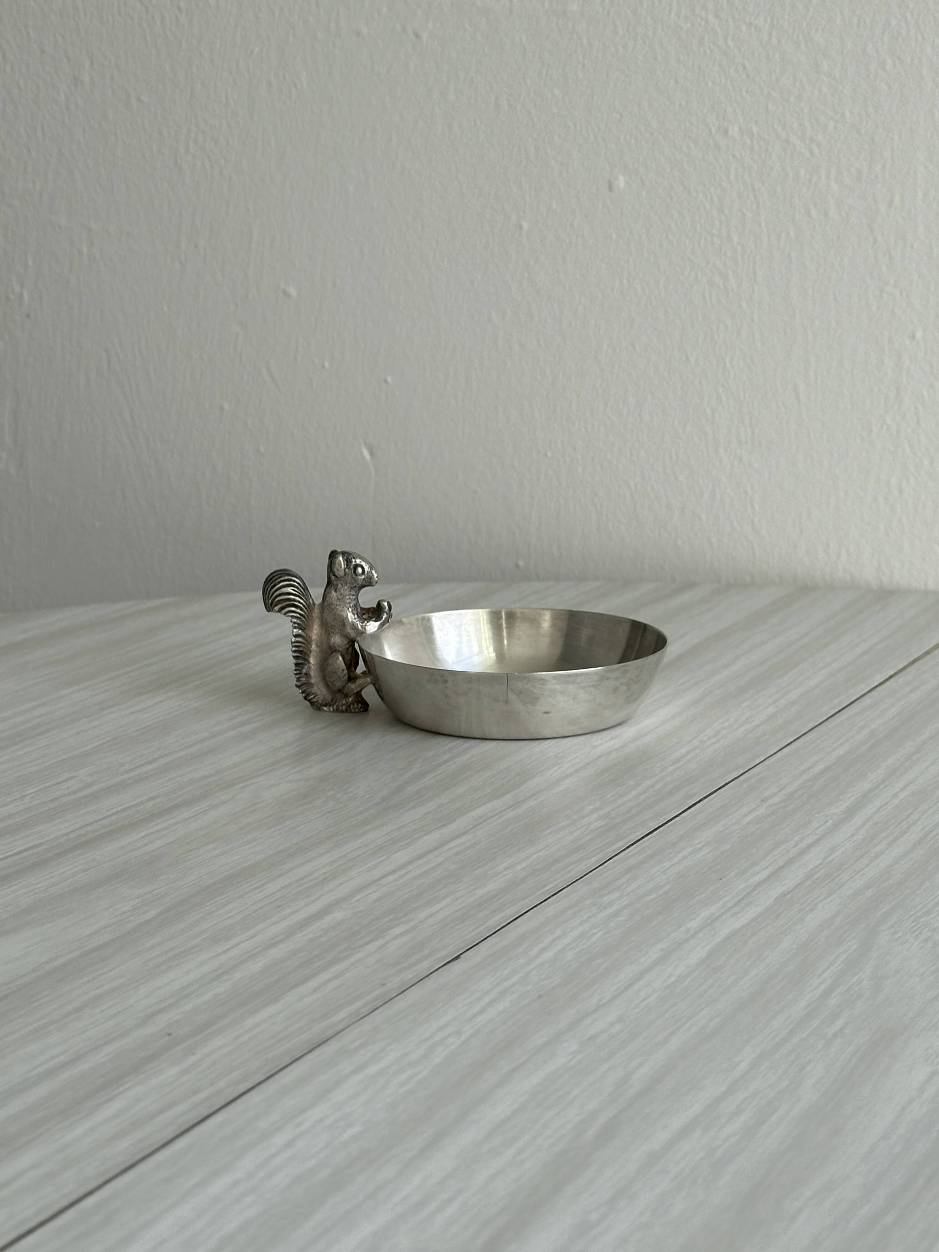 Metal cup with squirrel