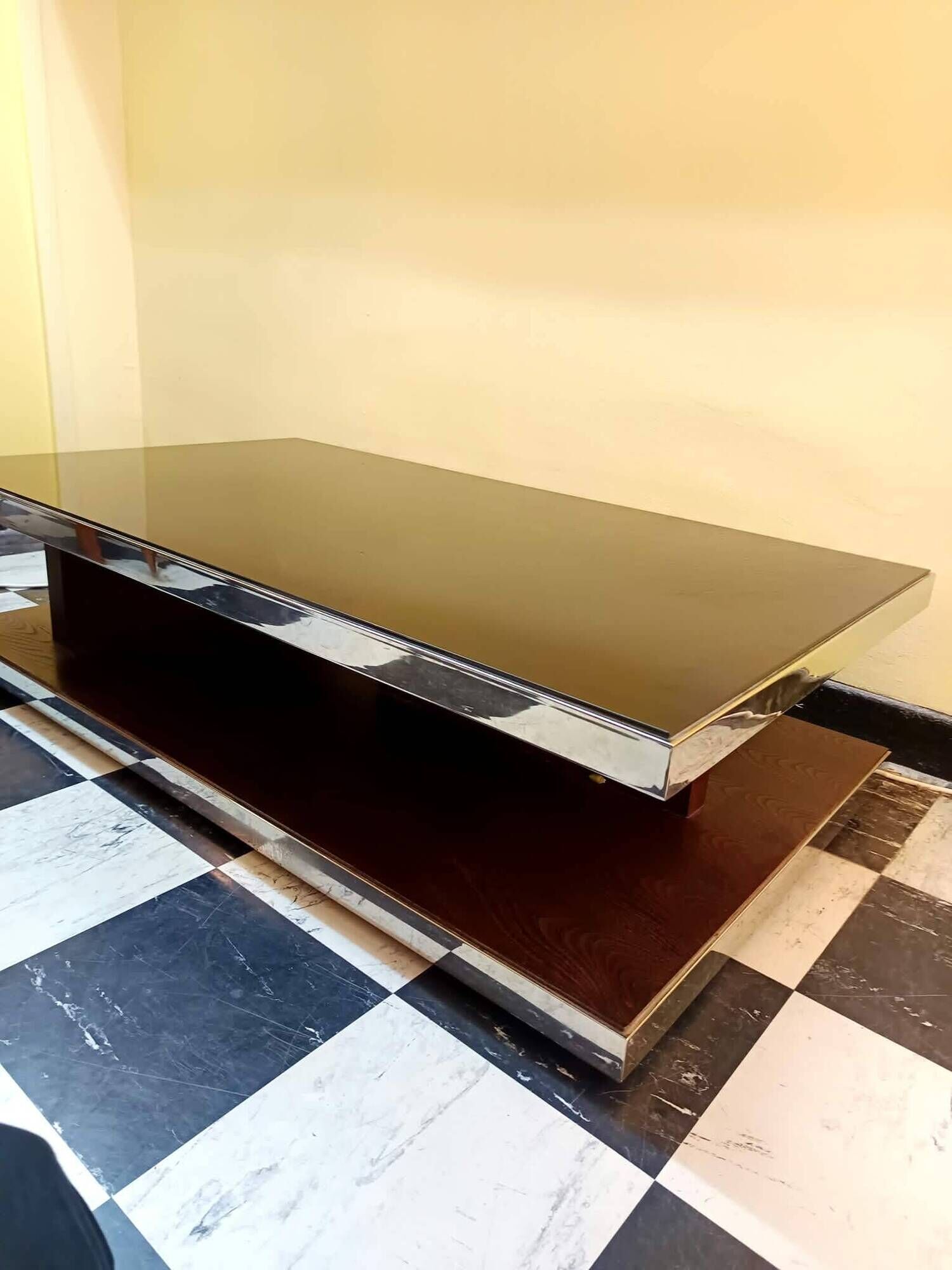 Designer coffee table in glass and chrome metal.